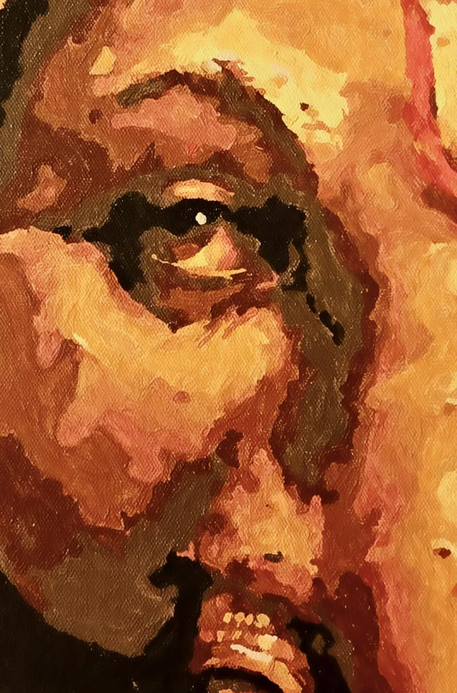 A close detail of the Ganesha portrait: the eye with its point of white light, set in folds of brown, orange and ochre paint laid on in flat strokes, the base of the trunk and the tusk’s jewelled band at the lower edge.